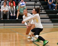 MCC Volleyball player bumps the ball on the court.