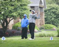 MCC men's golfer tees off in the rain.