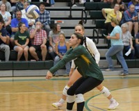 MCC Volleyball player Jaden Gomez bumping the ball during a match.