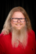 Headshot of Tore Skogseth wearing a red shirt.
