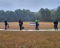 MCC clay target team lined up preparing to shoot at a competition.